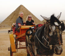 John and Peggy Woodcock ride a tourist wagon around the pyramids, which were nearly deserted during the revolution. Courtesy photo (See gallery at bottom for more photos.)