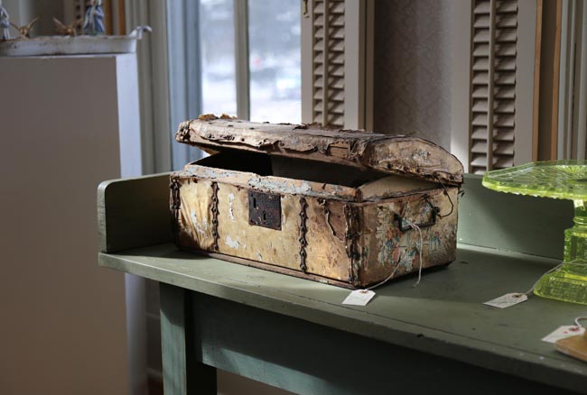 An antique doll trunk displayed at The Emerald Pencil. Photo by Naama Levy