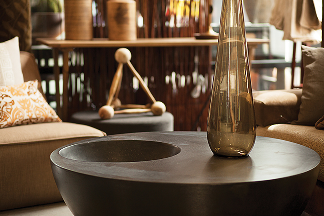 Spun-concrete coffee table burnished black and shaped like a kettle drum. Photo by Shannon Zahnle