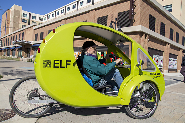 Local blacksmith Jack Brubaker navigates downtown Bloomington in his ELF. Photo by Darryl Smith