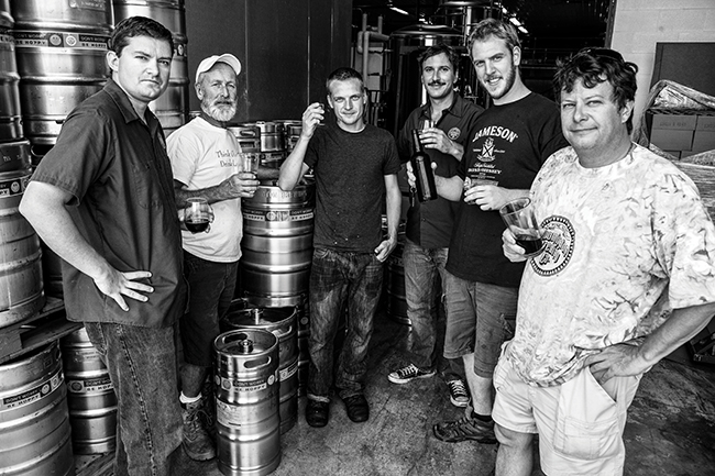 (l-r) Mark Cady, Floyd Rosenbaum, David Hamm, Mike Fox, Nick Banks, and Jeff Mease tasting the first Bloomington Brewing Company bottled beer, B7, in 2012. Photo by Shannon Zahnle
