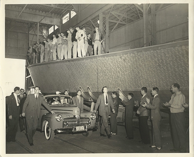 Val Nolan Jr., in the center of this picture, guarding the left side of FDR’s car during a 1942 tour of a shipbuilding facility. Courtesy photo
