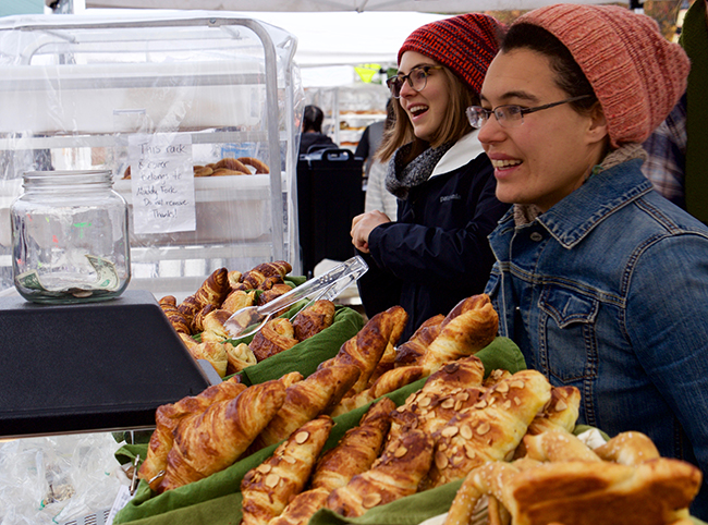 Greeting customers at the local farmers’ market. Photo by Merrill Hatlen