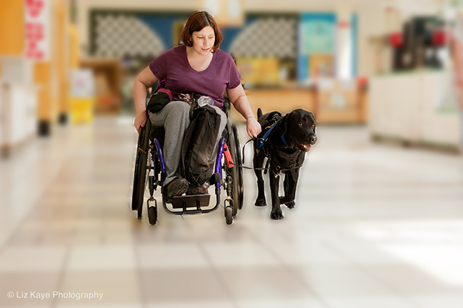 Jenelle Dorner with her service dog, Herbie, Photo by Liz Kaye.