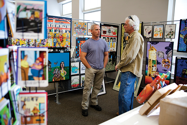 Artist Kevin Pope at his booth at a past showcase. Photo by Shannon Zahnle 