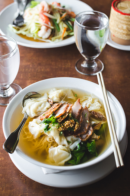 Som Tam (top) and wonton soup. Photo by Aubrey Dunnuck