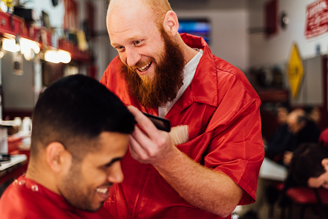 Rodney Pheifer chats with a customer as he trims. Photo by Stephen Sproull