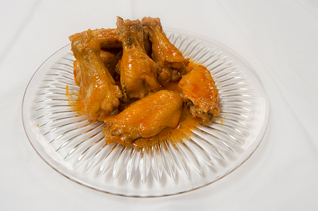 Glistening hot wings ready for consumption. Photo by Erin Stephenson