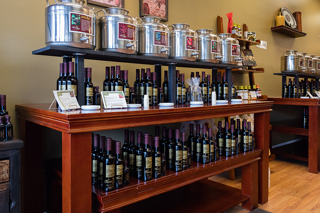 (above) Customers can sample olive oils from stainless steel fustis at The Olive Leaf. Photo by James Kellar