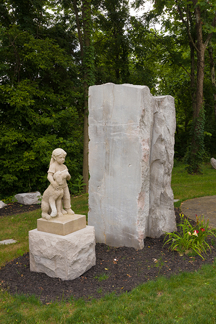 "Puppy Love" by sculptor John Fisher is the most prominent work of art along Ellettsville’s Heritage Trail. Photo by James Kellar