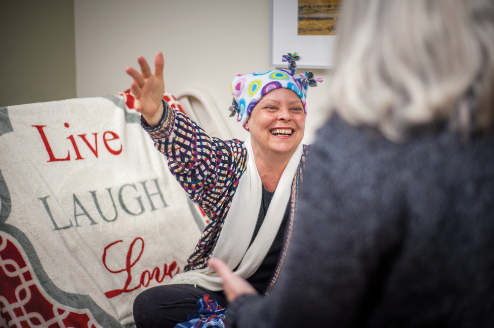 Lauren Lane Powell greets Linda Summers as she arrives to a chemotherapy session. Photos by  Rodney Margison