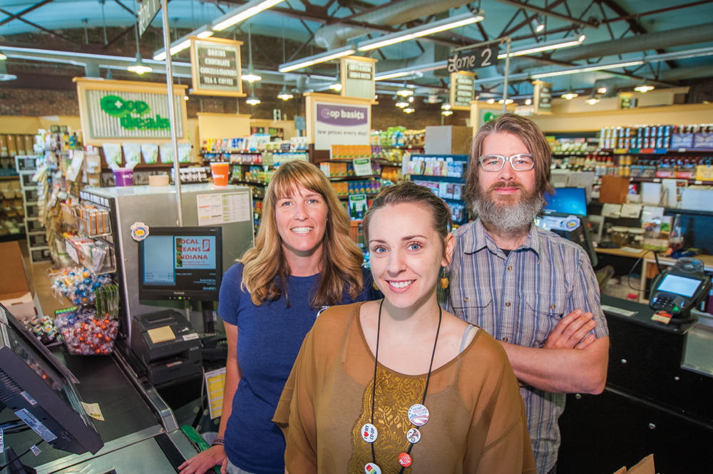 (l-r) Catie Schamel, Erica Dorsey, and Wade van Orman. Dorsey and van Orman are two of Bloomingfoods’ top fundraising cashiers. Photo by Rodney Margison