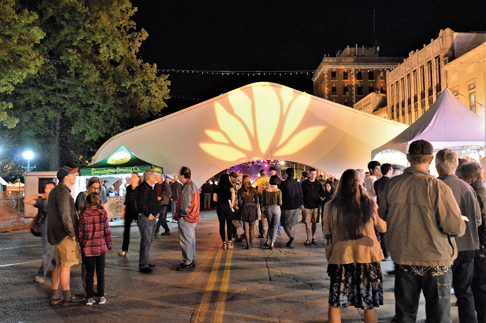 Lotus Festival attendees near the Lotus tent on 6th Street between College and Walnut. Photo by Jaime Sweany