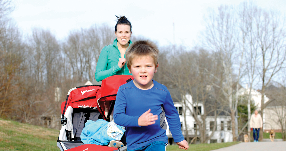 A young runner finishes up his second mile at Run for Fun practice outside of the Monroe County YMCA.