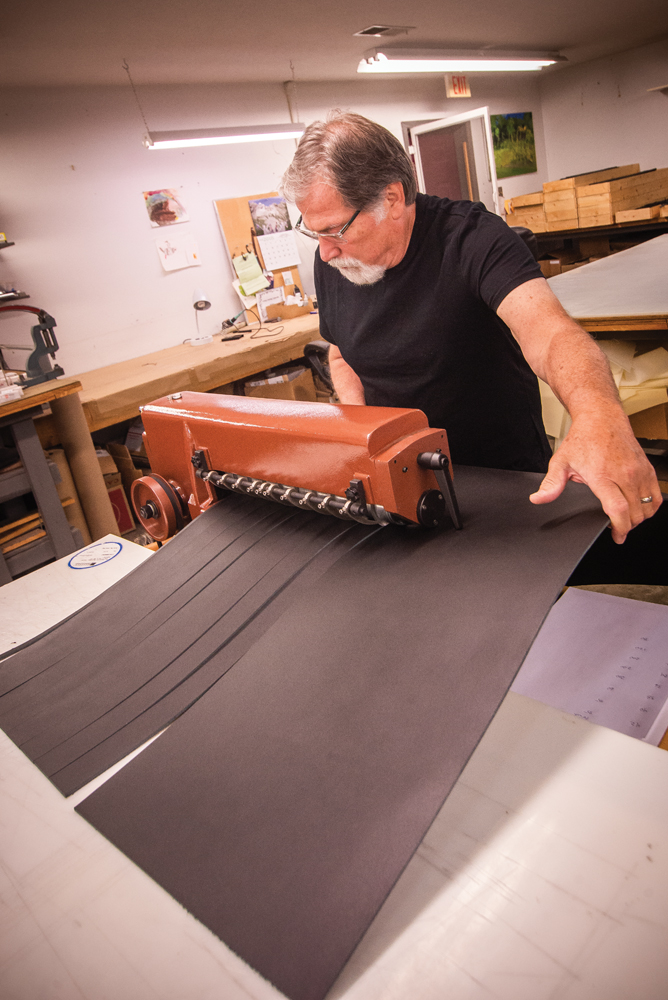 Long cuts the leather for military belts.