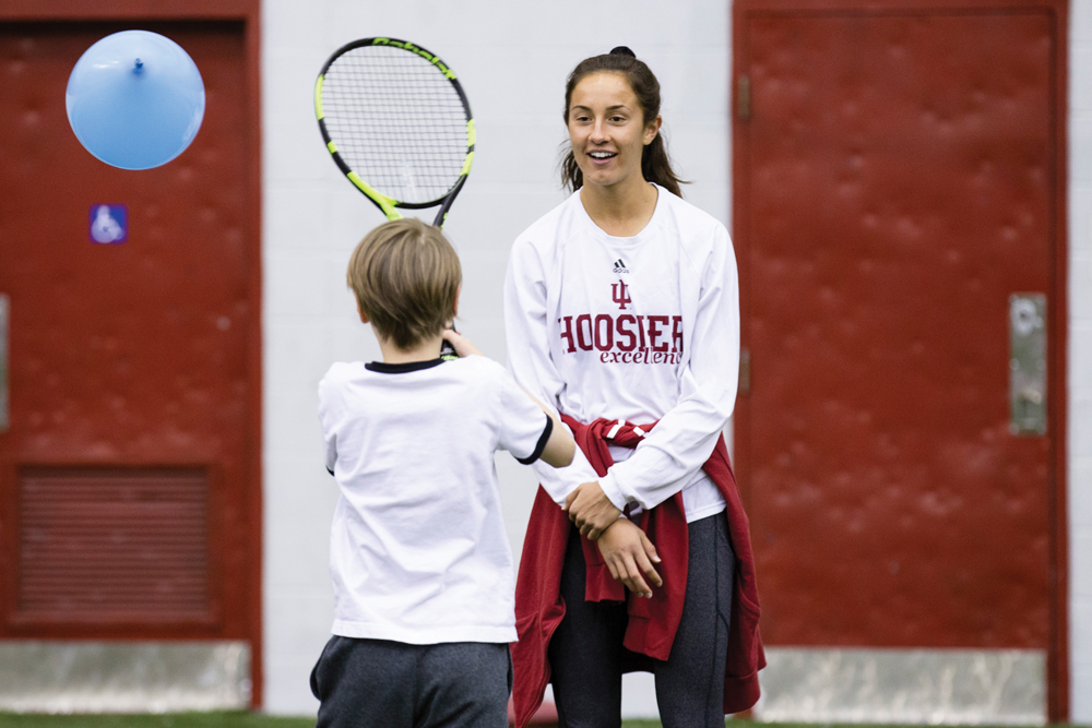 Allison Jorden playing around with a new friend. Photo by Chaz Mottinger