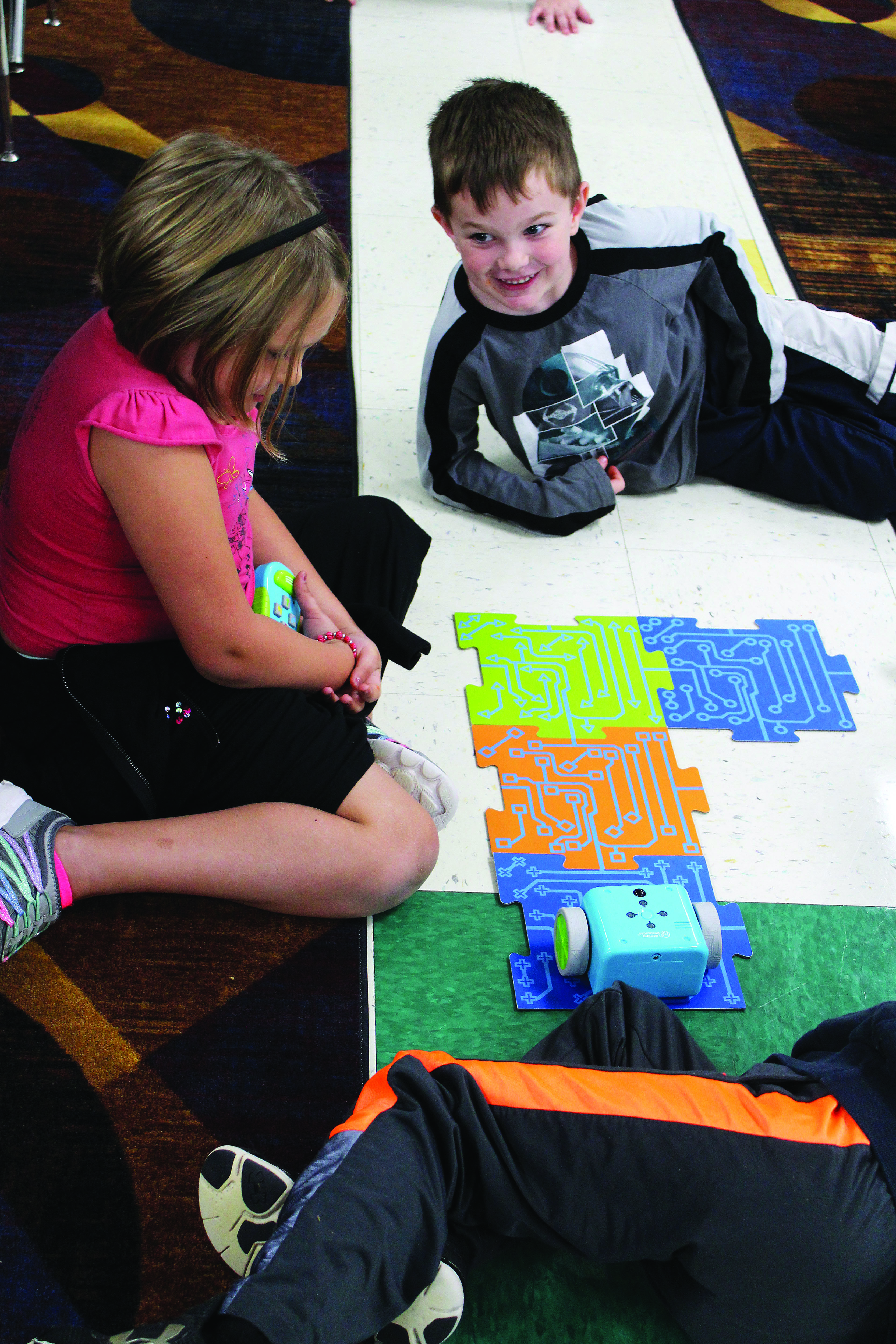 Edgewood Primary School students take turns learning how to code Botley, a small robotic toy used to teach coding during STEM activities. Photo by Nicole McPheeters