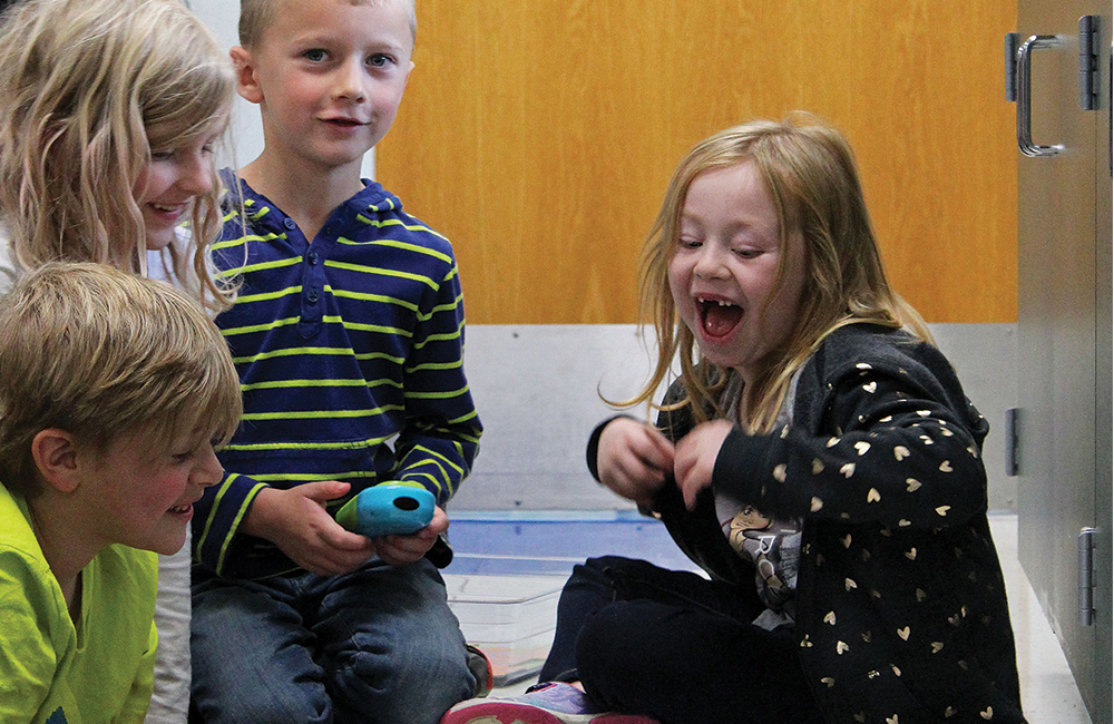 Edgewood Primary School students take turns learning how to code Botley, a small robotic toy used to teach coding during STEM activities. Photo by Nicole McPheeters