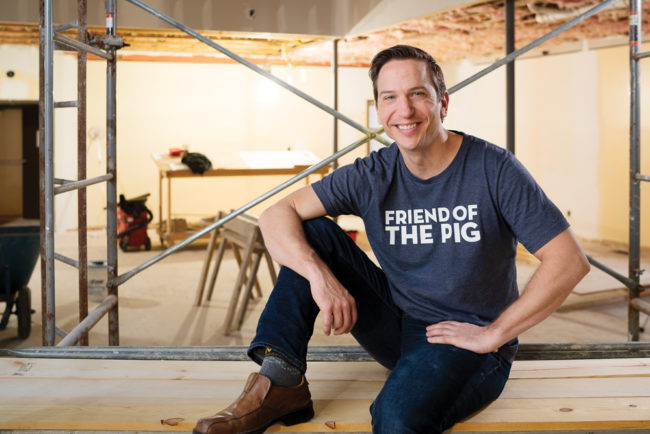 John Armstrong. The phrase on his T-shirt is a reference to the Pigasus Pictures logo of a flying pig. Photo by  Martin Boling