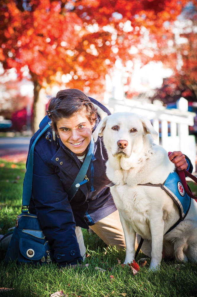 Adria Nassim and her service dog, Lucy. Photo by Rodney Margison