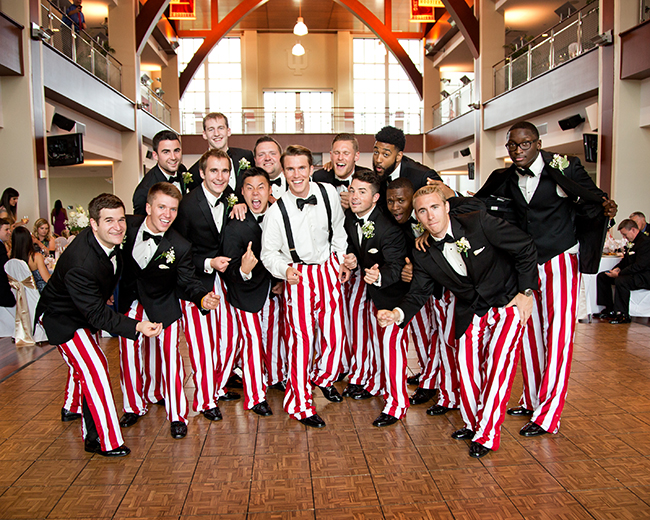 Jordan with his groomsmen and ushers in their candy-striped warm-up pants. Photo by Hudson Photography