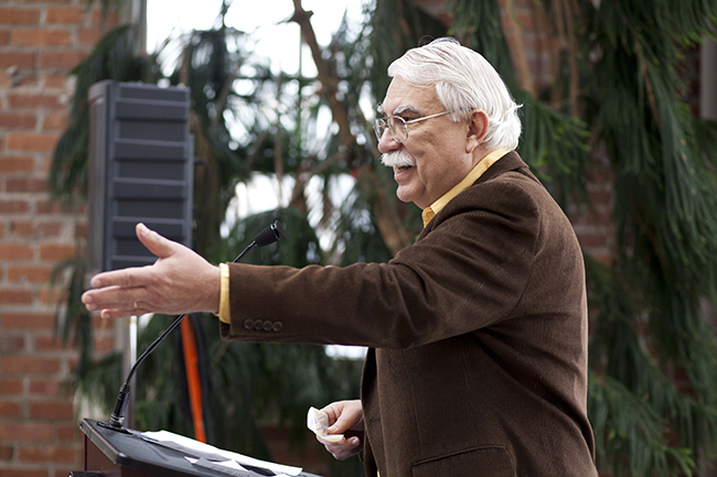Byron Bangert, Bloomington Human Rights Commission chair, announced the first Fair Labor Initiative decal recipients at City Hall in December 2014. Photo by Shannon Zahnle.