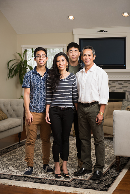 Jennifer Mai at home with her family: (l-r) younger son Ryan Nguyen, Jennifer, older son Christopher Nguyen, and husband Peter Nguyen. Photo by Stephen Sproull