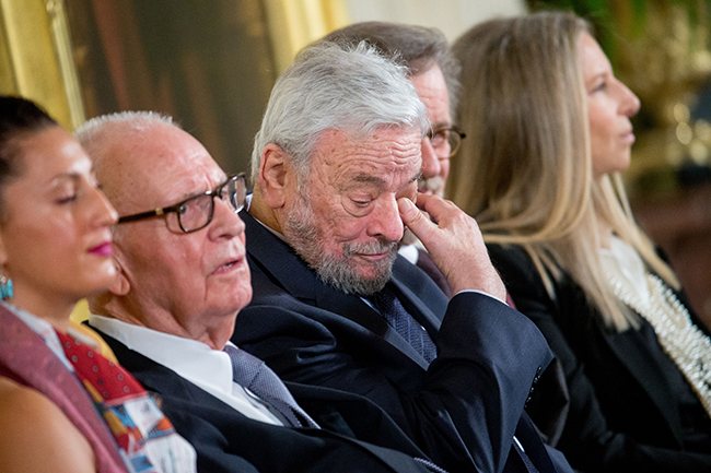 Lee Hamilton looks on as another winner accepts the Medal of Freedom. To his right are fellow honorees Stephen Sondheim, Steven Spielberg, and Barbra Streisand. To his left is Peggen Frank, who accepted for the late Billy Frank Jr., a champion of Native American rights. AP Images.