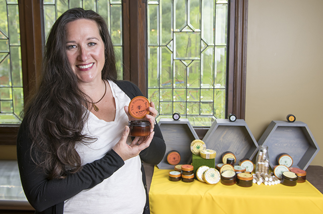 Jennifer Bland with a selection of her products from The Virtuous Bee. Photo by Darryl Smith