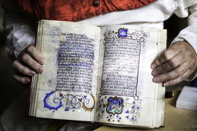 Calligraphers used a quill pen and oak gall ink, and paints were made by hand, to dec- orate the codex. Photo by Tyagan Miller 