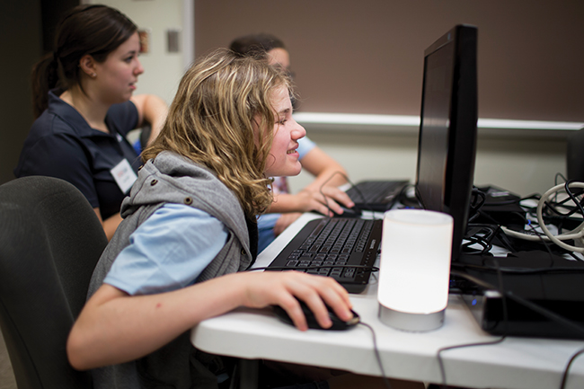Haley Shelburne, 13, works on a video game she created at GirlPowered! Photo by James Brosher, IU Communications