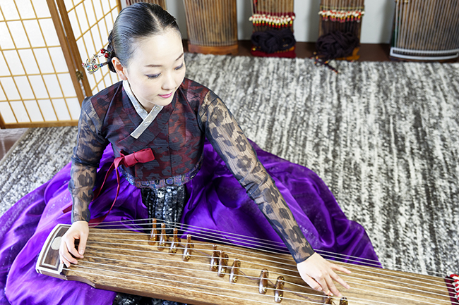 Eun-Sun Jung plays the gayageum, an ancient 12-string Korean instrument. Photos by Martin Boling 