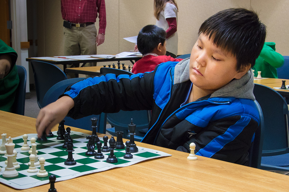 Chess club member Lucas Jones makes his move. Photo by James Kellar