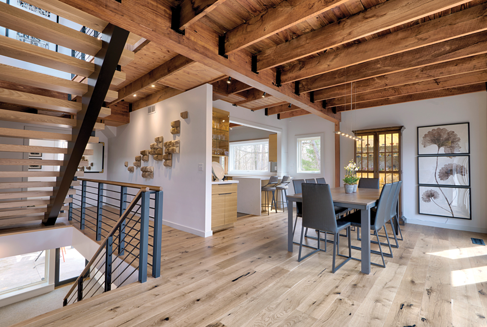 During the home’s renovation, original red oak joists were left intact and complemented by an entirely new staircase and rail system. The carpets on the dining level were removed and replaced with 7-inch, engineered, pre-finished oak.