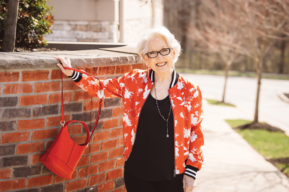 A reversible silk bomber jacket with a colorful floral pattern is the centerpiece of Karen Hicks’ eye-catching ensemble. Jacket by Alice and Olivia, tank top by Joie, necklace by Ela Rae, and bag by Rag & Bone.