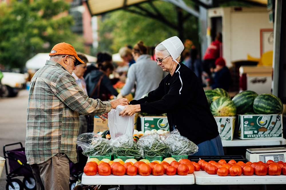 Vendors meet shoppers at the Bloomington Community Farmers' Market. Photos by Stephen Sproull