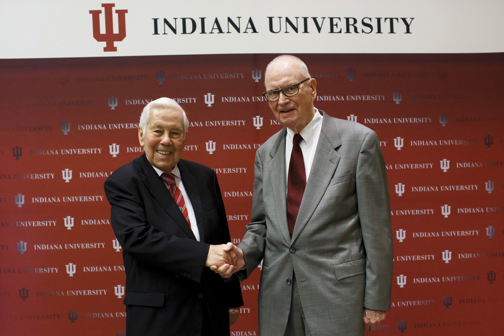 (l-r) Former Indiana Senator Richard Lugar and former Indiana Congressman Lee Hamilton shake hands at the ceremony renaming the Indiana University School of Global and International Studies in their honor. Photo by Liz Kaye, IU Communications