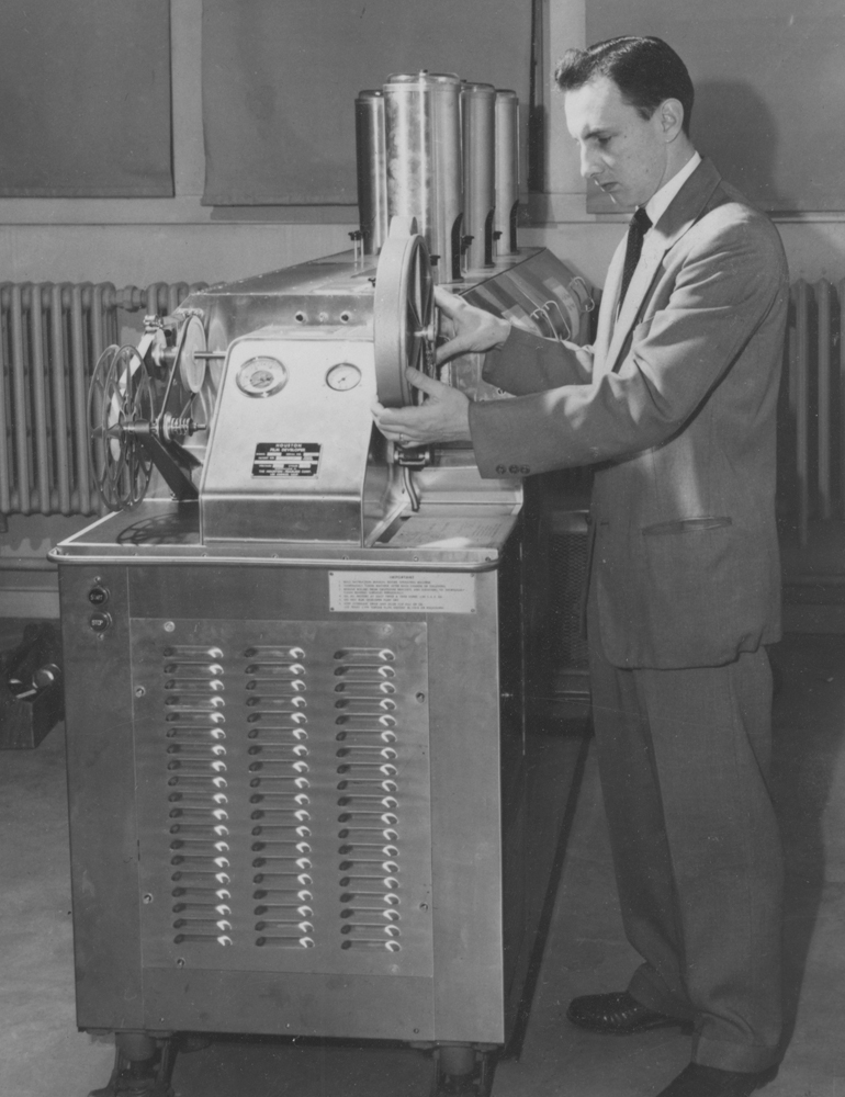 Former WTIU General Manager Bill Kroll with a kinescope, a film made of a live television broadcast as a permanent recording for rebroadcast and archival purposes.