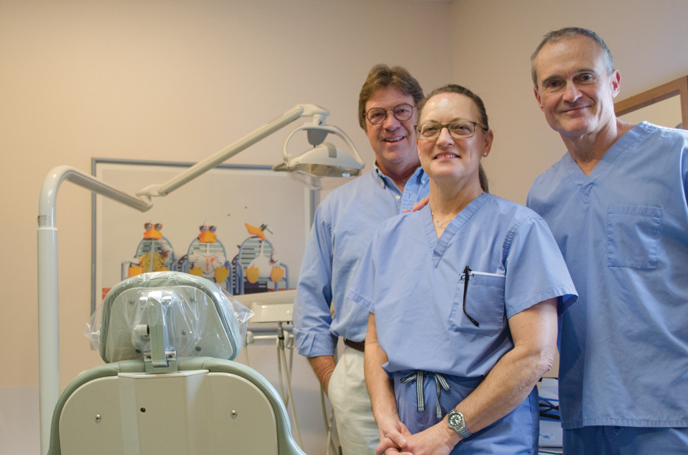 Dr. Park Firebaugh, Dr. Steve Pritchard, and dental hygienist Jan Firebaugh. Photo by Mike Waddell