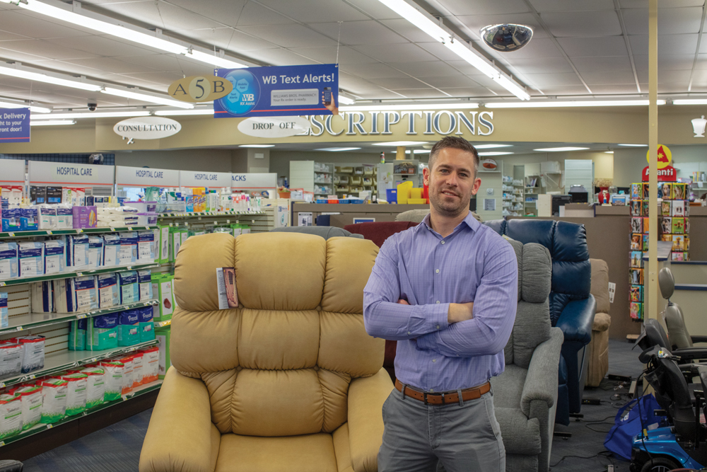 Shaun Huttenlocker with a selection of lifestyle chairs at Williams Bros. Photo by James Kellar